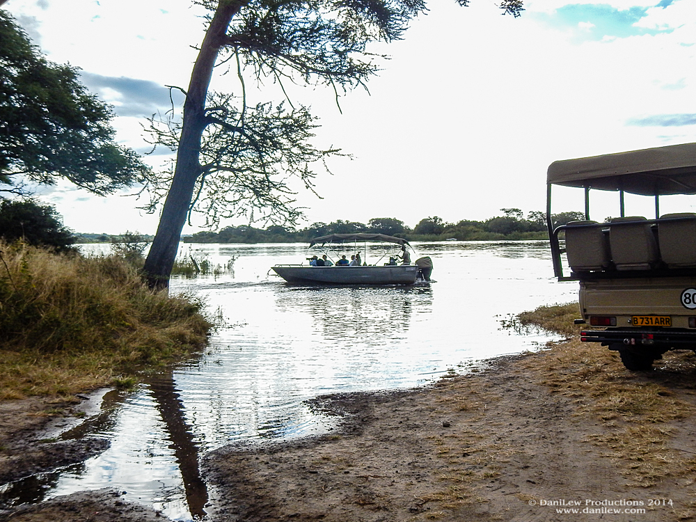 Small boat back to Zambia Small boat back to Zambia on the Chobe River in Botswana - taken with a Nikon Coolpix AW110