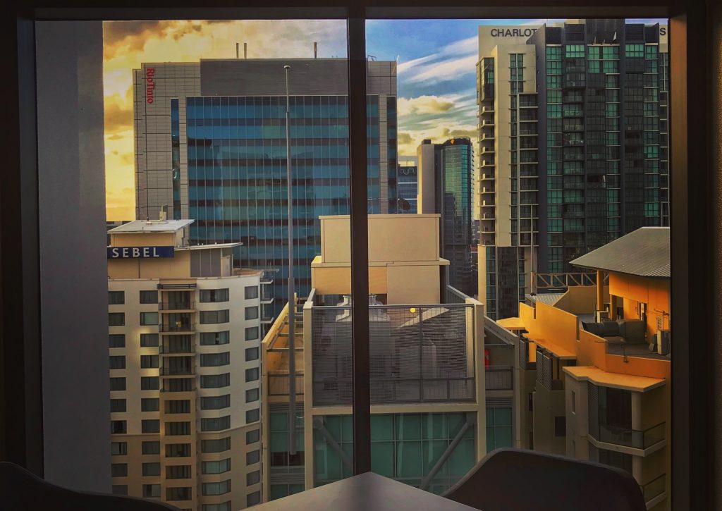 Sunset behind tall Brisbane CBD buildings, image taken with an iPhone 7 from rooftop bar at Four Points By Sheraton Hotel