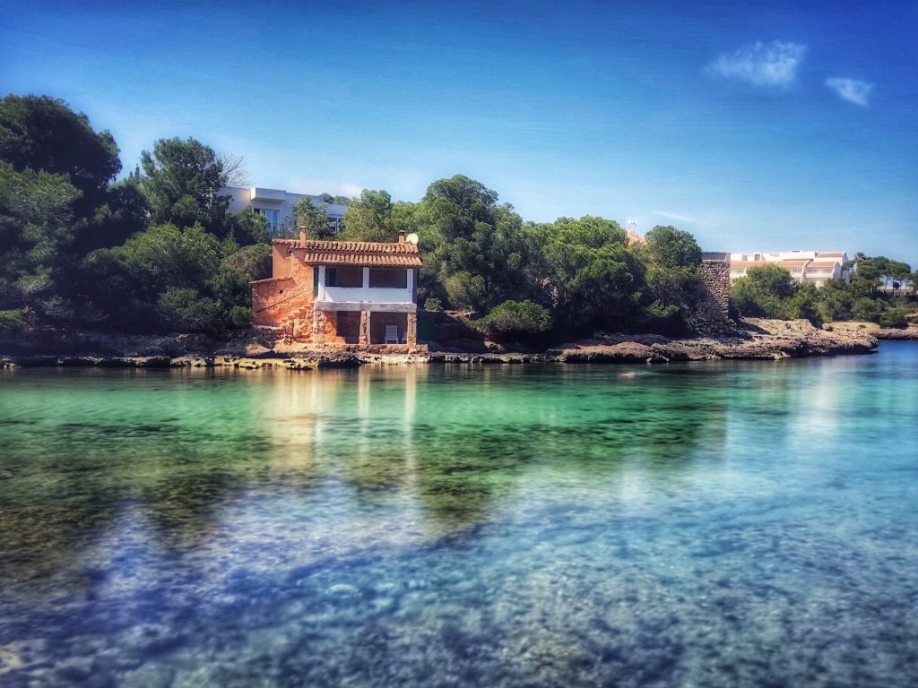 Crystal turquoise waters of Mallorca as shown on SelfishMe Travel LLC